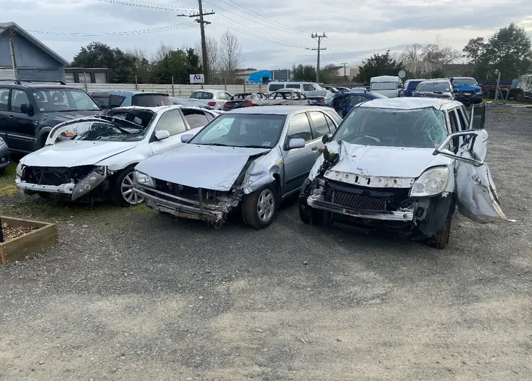 Damaged vehicles stored in the Waipa Towing salvage yard