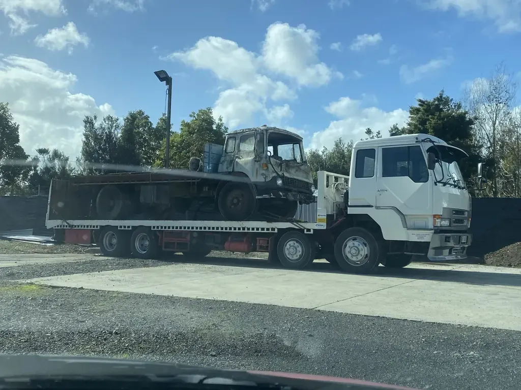 Salvage truck collecting scrap vehicle