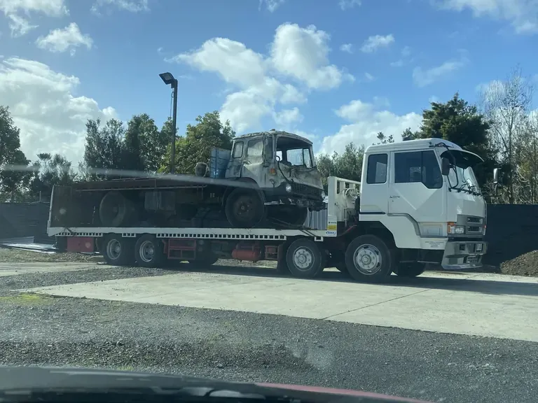 Wrecked truck salvaged onto a transporter